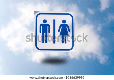 Bathroom sign on the sky background