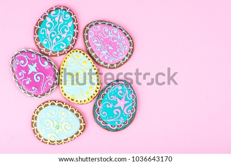 Easter eggs formed as tasty homemade cookies on bright background. Studio Photo