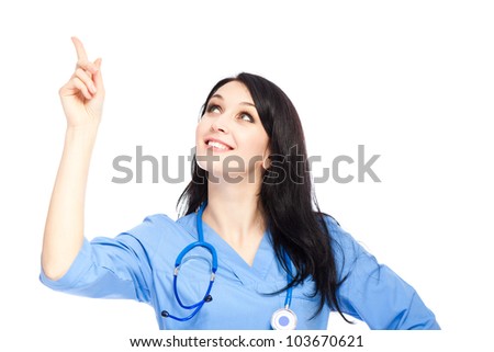 medical doctor woman smile with stethoscope, nurse wear blue surgery suit, point finger to corner up, concept of advertisement product, empty copy space. Isolated over white background