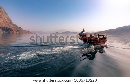 Dhow cruise in the fjords of Musandam, Oman Royalty-Free Stock Photo #1036719220