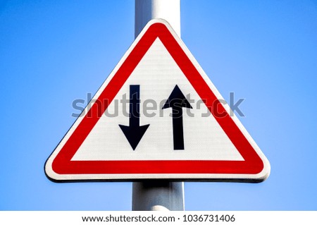 Traffic or road sign with a blue sky on a background