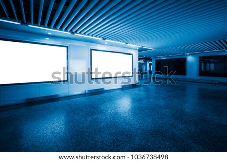 empty hall with some blank billboards,blue toned.