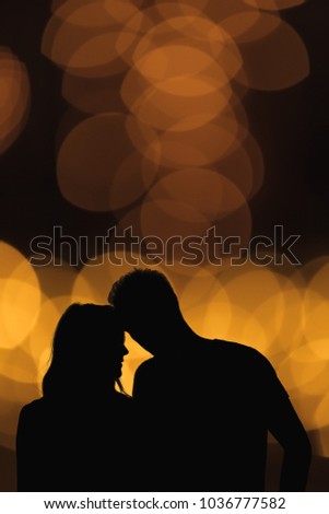 Silhouette of a couple with de-focused / bokeh lights. Elements of this image are my work.