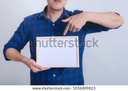 A man holding a white board on white background