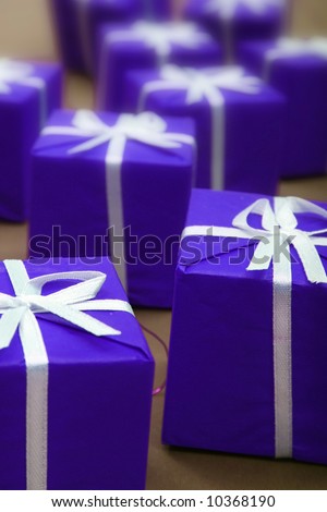 Gifts in blue paper isolated on white background