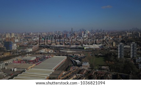 Drone image (aerial) of the Bus and Train depot in South London, England with the london skyline on the horizon.