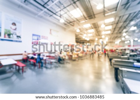 Blurred food court with picnic tables near checkout counter at wholesale store in America. Vintage tone