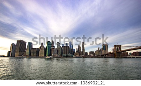 skyline new york with Brooklyn Bridge and a great sky