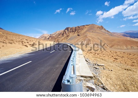 yellowish mountain road view in tibet of China
