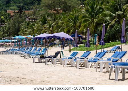 Colorful canvas beds on the beach with beautiful blue sky at phuket