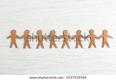 Paper people on light background. Unity concept