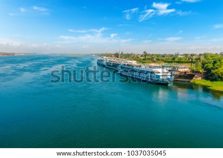 Cruise ship on the Nile river. Cairo. Giza. Egypt. Travel background. Vacation holidays background wallpaper Royalty-Free Stock Photo #1037035045