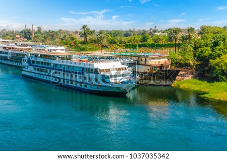 Cruise ship on the Nile river. Cairo. Giza. Egypt. Travel background. Vacation holidays background wallpaper Royalty-Free Stock Photo #1037035342