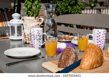 Breakfast in the morning by the sea on terrace in summer time.