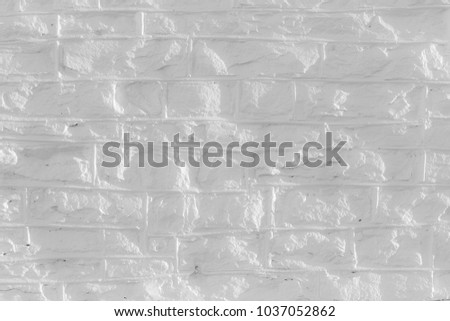 Monochrome uneven brick structure texture for background.