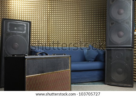 Guitar amplifier and audio system in recording studio.