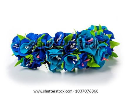 
Wreath of flowers from fameirana handmade gently blue and purple on a white background