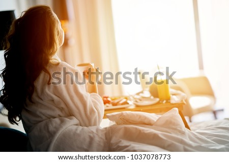 Breakfast in bed, cozy hotel room. concept Royalty-Free Stock Photo #1037078773