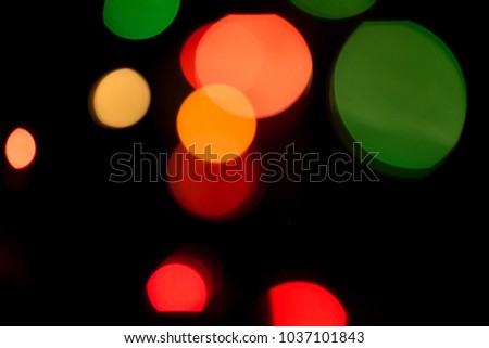 Colored bokeh textures - abstract photo on the black background for adding and editing as the background layer in the multiply regime