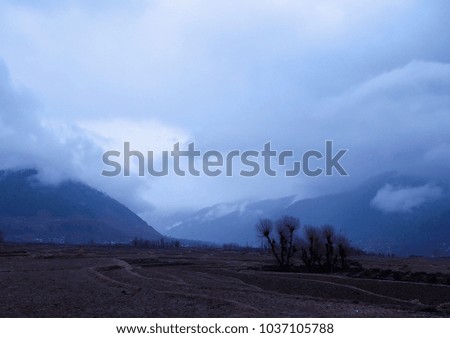 BEAUTIFUL VIEW OF CLOUDY SKY AND MOUNTAINS
