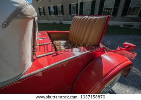 Rumble seat in vintage classic red antique car convertable Royalty-Free Stock Photo #1037158870