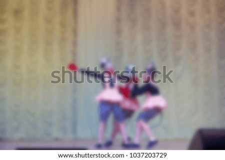 Folk dances of children and teens theme abstract blur background with bokeh effect.