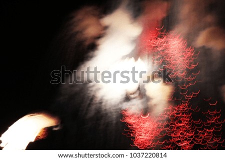 An abstract background of firework falling down from a dark sky with a little bit of smoke.