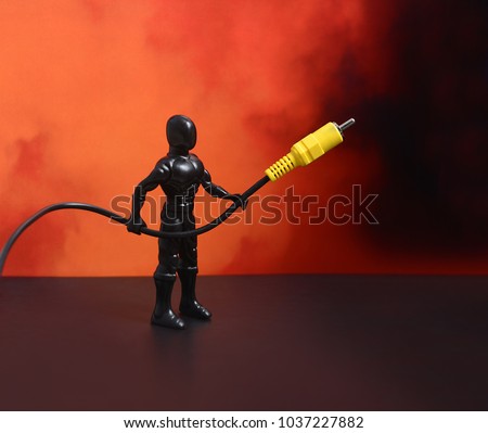 Electrical equipment. Background and texture. Cable for flash. Electrical equipment. Background and texture. The cable is in Superman's hands on a red background. Power tools and equipment