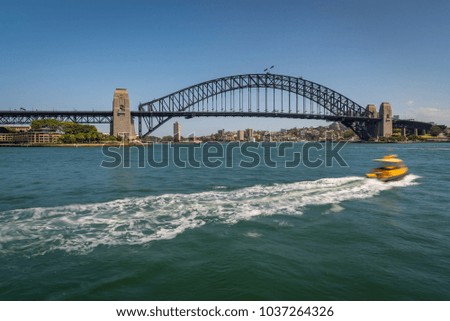 Water Taxi at Sydney Harbor Bridge on a sunny day at Circular Quay, Australia.