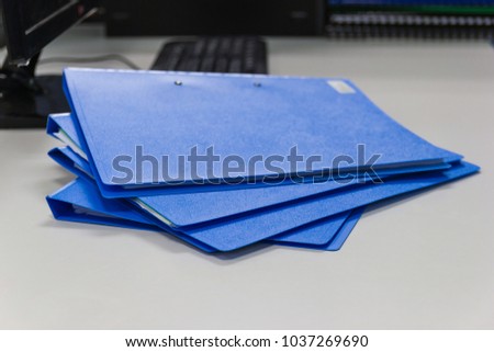 file folder and Stack of business report paper file  on desk in office, business concept.