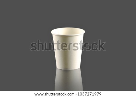 Plastic cups on a gray background