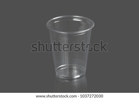 Plastic cups on a gray background