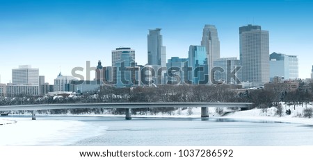Winter season Downtown Minneapolis and Frozen  Mississippi River Panorama