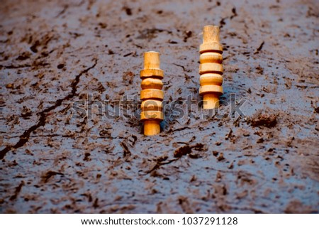 Two cricket bells kept on a soil surface unique stock photograph