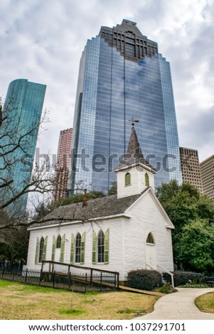 Historic White Church amidst Modern Skyscrapers in Downtown Houston, Texas - USA 