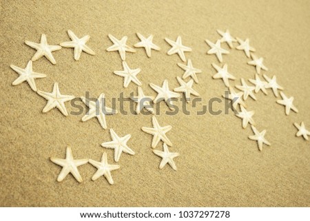 white starfish the inscription of the word "spa" on the sand. Spa in the sand from the stars of the sea. concept of vacation and travel