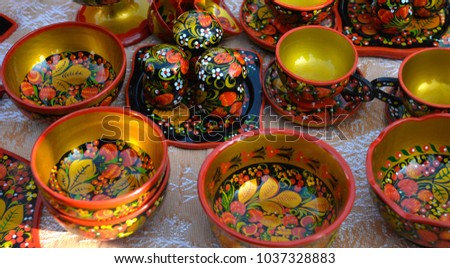 Wooden dishes in the Russian-folk style at the festive fair in the central square.