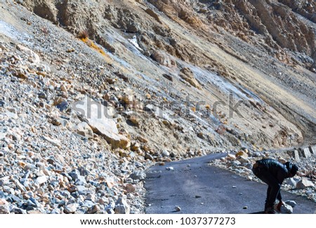 Fallen rocks on the smooth highway roads of Ladakh, Jammu and Kashmir, India.