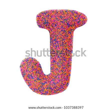Beautiful Alphabet J, made by multi color sand, isolated on white background