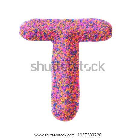 Beautiful Alphabet T, made by multi color sand, isolated on white background