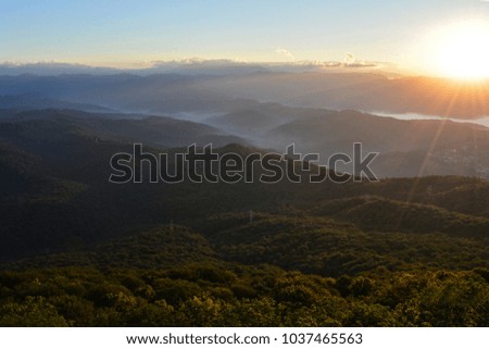 Sunrise in front of mountains.