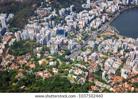 Aerial picture of the west side of Rio de Janeiro, near the Corcovado Hill, with the highlight of Epitacio Pessoa Avenue and the beginning of Rodrigo de Freitas Lagoon in the top right corner.
