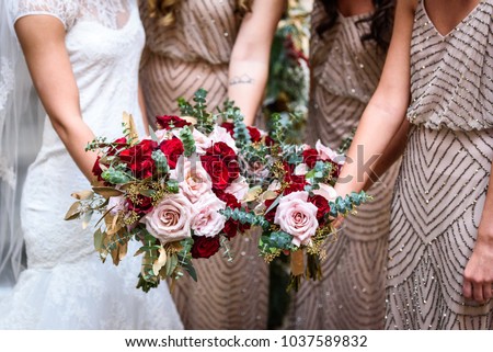 Wedding Dresses, Bridesmaids, and bouquets  Royalty-Free Stock Photo #1037589832