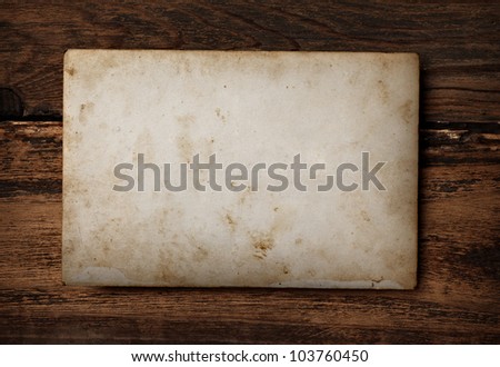 close up of an old photo on a wooden background