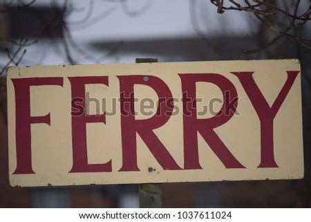 ferry sign with snow in background
