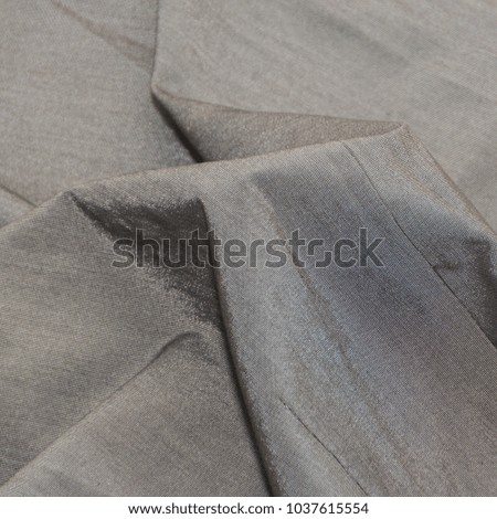 background, grey crumpled shiny fabric, texture