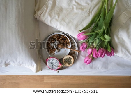 tulips, breakfast in bed and sign "Good morning!" 