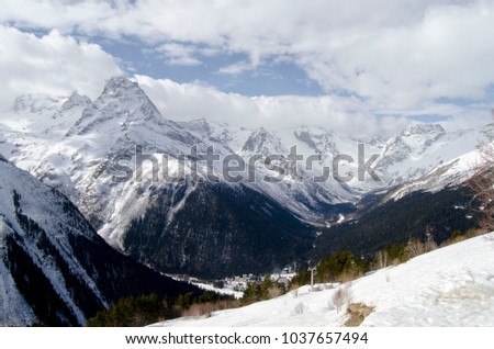 Big, snowy, sunny mountain picture. North winter nature. Sunny day.