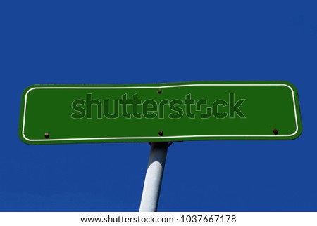 Road sign with empty space and sky in the background.