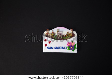 Souvenir - Fridge magnet from San Marino on black background